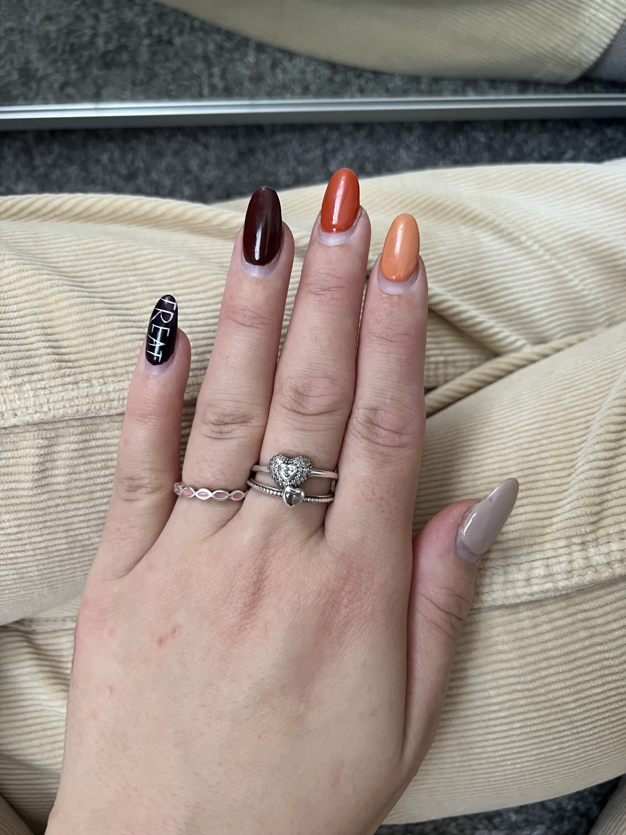 An autumn mix of colours with one black accent nail